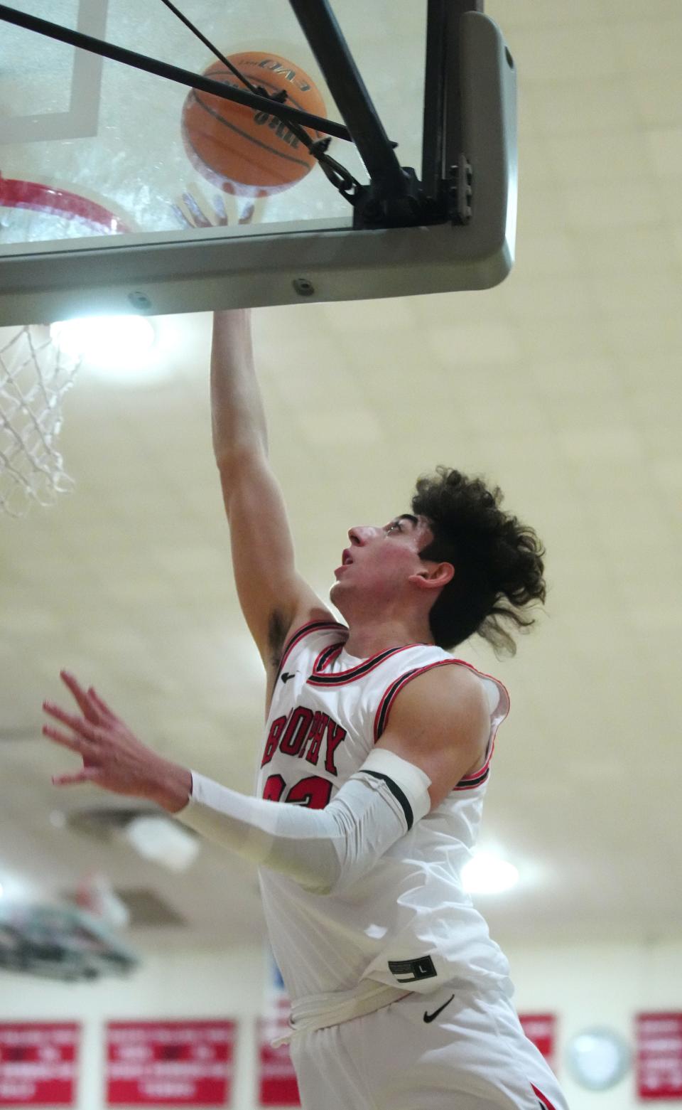 Jan 7, 2022; Phoenix, AZ, United States; Brophy Prep's Arman Madi (23) makes a layup against Basha during a game at Brophy Prep. Mandatory Credit: Patrick Breen- The Republic