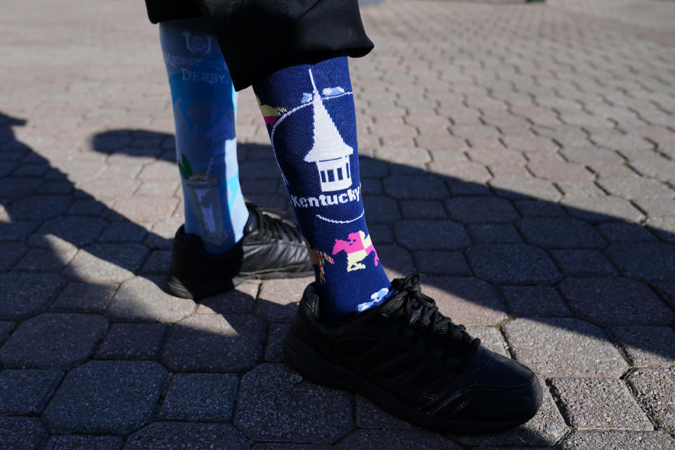 A man wears Kentucky Derby-themed socks before the 147th running of the Kentucky Derby at Churchill Downs, Saturday, May 1, 2021, in Louisville, Ky. (AP Photo/Brynn Anderson)