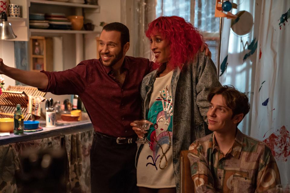 Robin de Jesús (far left), Mj Rodriguez and Ben Levi Ross star as a theater composer's friends cheering him on to finish his musical in "tick, tick...BOOM!"