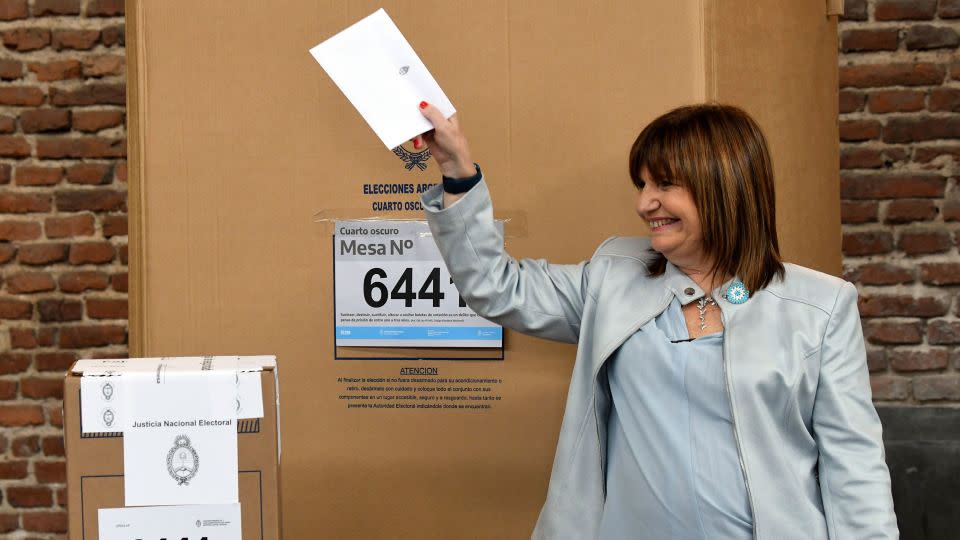  Bullrich holds up her marked ballot before putting it into the ballot box during primary elections in Buenos Aires, Argentina, Sunday, Oct. 22, 2023. - Gustavo Garello/AP