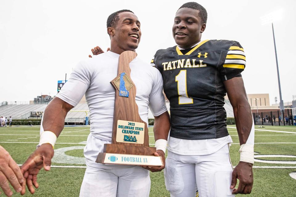 Tatnall seniors Rahshan LaMons (2) and Micah Stamper (1) pose with the DIAA Class 1A football championship trophy after their 26-7 victory over Charter of Wilmington on Saturday at Delaware Stadium. LaMons was named Class 1A Offensive Player of the Year by the Delaware Interscholastic Football Coaches Association on Monday.