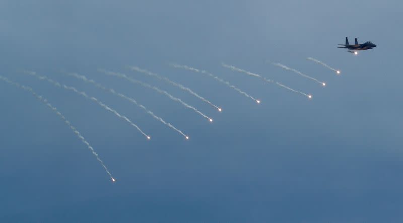 Singapore's Republic of Singapore Air Force (RSAF) F-15SG performs an aerial display during a media preview of the Singapore Airshow in Singapore