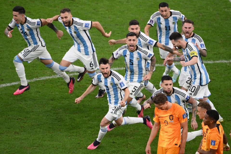 Argentina players celebrate after they won on penalty shoot-out the Qatar 2022 World Cup quarter-final (AFP via Getty Images)