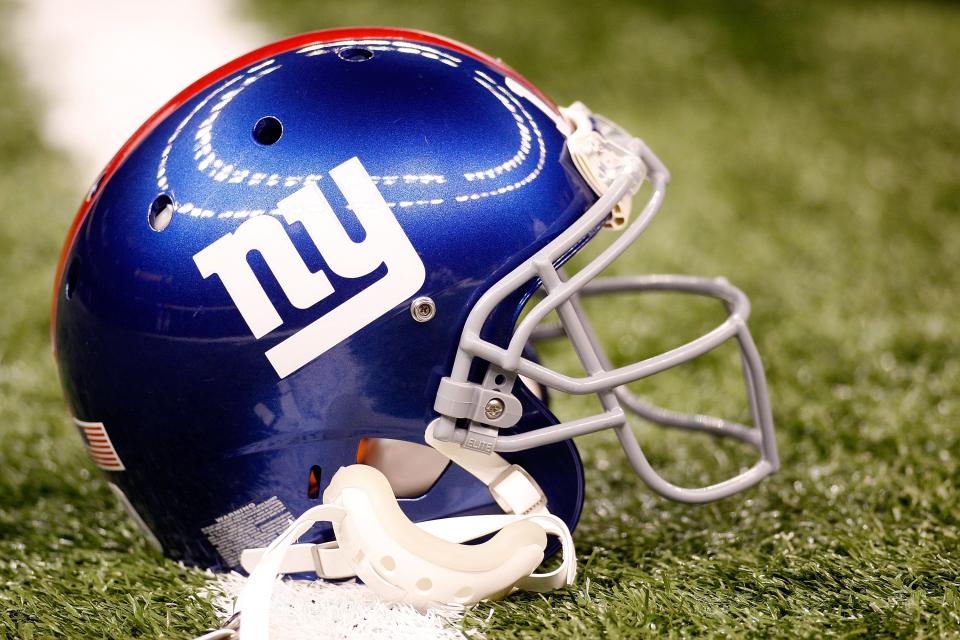 Eli Manning Wearing New York Giants Helmet