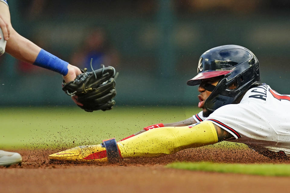 Atlanta Braves' Ronald Acuña Jr. is staged out as he attempts to steal second base during the first inning of the team's baseball game against the New York Mets on Tuesday, Aug. 16, 2022, in Atlanta. (AP Photo/John Bazemore)