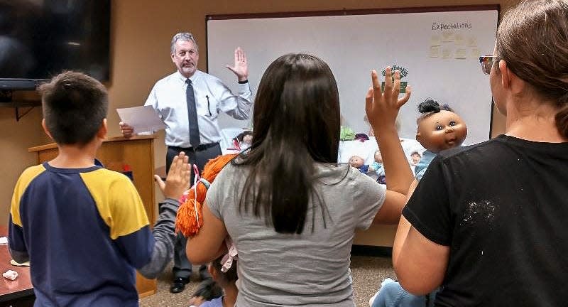 Judge John Bianco presides over the "adoption" of Cabbage Patch dolls for CASA kids.