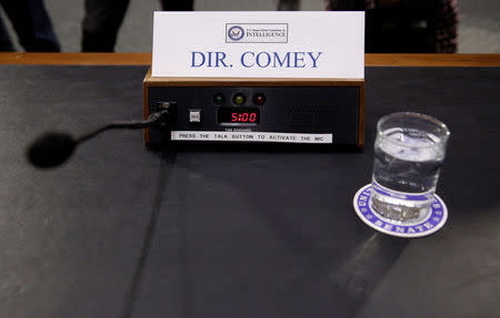 A microphone and glass of water stand ready for FBI Director James Comey before a Senate Intelligence Committee hearing on “Russia’s intelligence activities" on Capitol Hill in Washington, U.S., January 10, 2017. REUTERS/Joshua Roberts