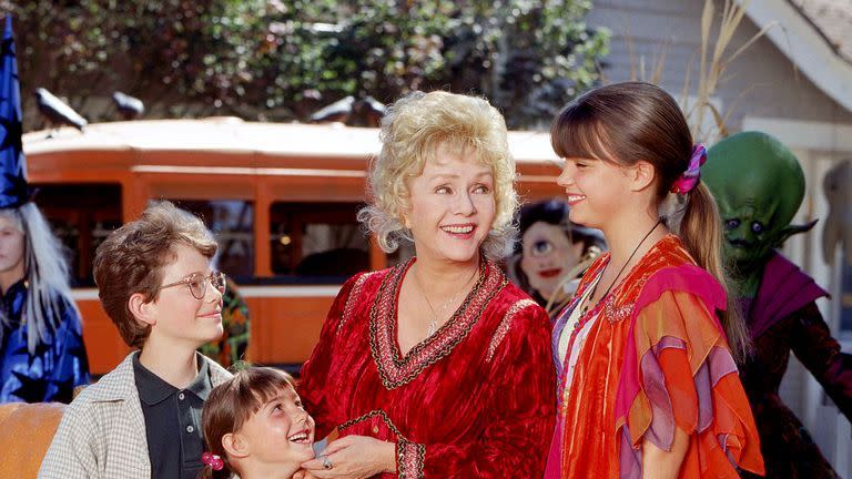 aggie shares a smile with her family in a scene from halloweentown a good housekeeping pick for best halloween movies