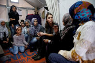 Queen Rania of Jordan (C) meets with Syrian refugee women during her visit at the Kara Tepe refugee camp on the Greek island of Lesbos, April 25, 2016. REUTERS/Alkis Konstantinidis