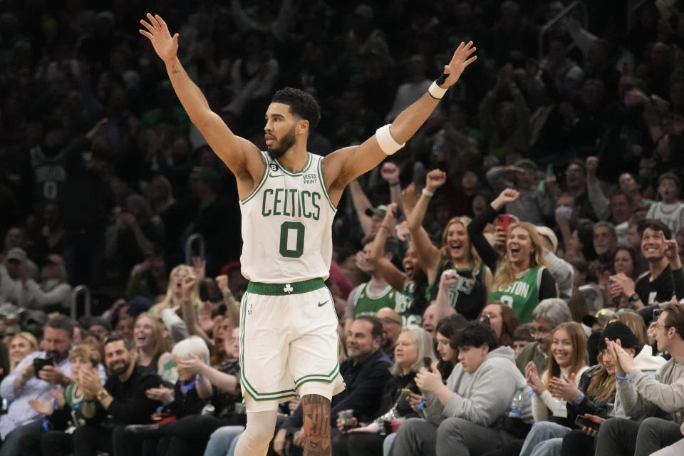 Boston Celtics forward Jayson Tatum (0) celebrates during the second half of an NBA basketball game against the Houston Rockets, Tuesday, Dec. 27, 2022, in Boston. (AP Photo/Charles Krupa)