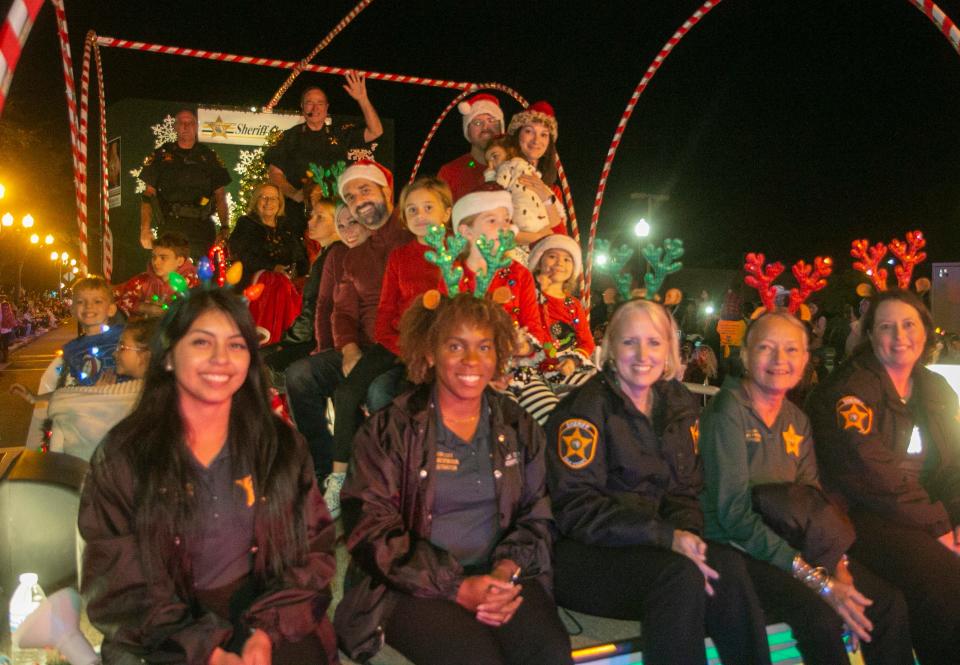 Polk County Sheriff Grady Judd and his family and staff wave to the crowd during the annual Christmas parade in downtown Lakeland in 2021.