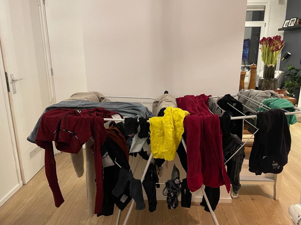 clothes drying on a drying rack inside an apartment in europe