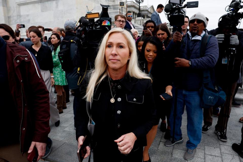 PHOTO: Rep. Marjorie Taylor Greene is followed by reporters after speaking outside of the U.S. Capitol Building following a vote on a funding bill that would avert a government shutdown on March 22, 2024 in Washington, DC. (Anna Moneymaker/Getty Images)