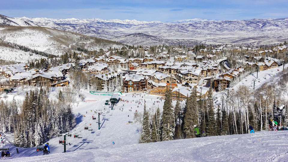 A chair lift brings skiers to top of ski slopes of Deer Valley Ski Resort, near Park City and The Canyons.