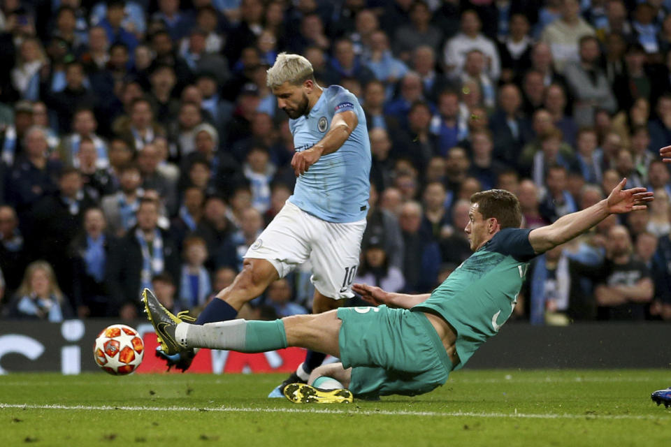 Manchester City's Sergio Aguero, left, scores his side's fourth goal during the Champions League quarterfinal, second leg, soccer match between Manchester City and Tottenham Hotspur at the Etihad Stadium in Manchester, England, Wednesday, April 17, 2019. (AP Photo/Dave Thompson)