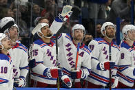 New York Rangers center Barclay Goodrow (21) waves to the crowd after the Tampa Bay Lightning played a video tribute to Goodrow during the first period of an NHL hockey game Friday, Dec. 31, 2021, in Tampa, Fla. Goodrow won a Stanley Cup with the Lightning. (AP Photo/Chris O'Meara)