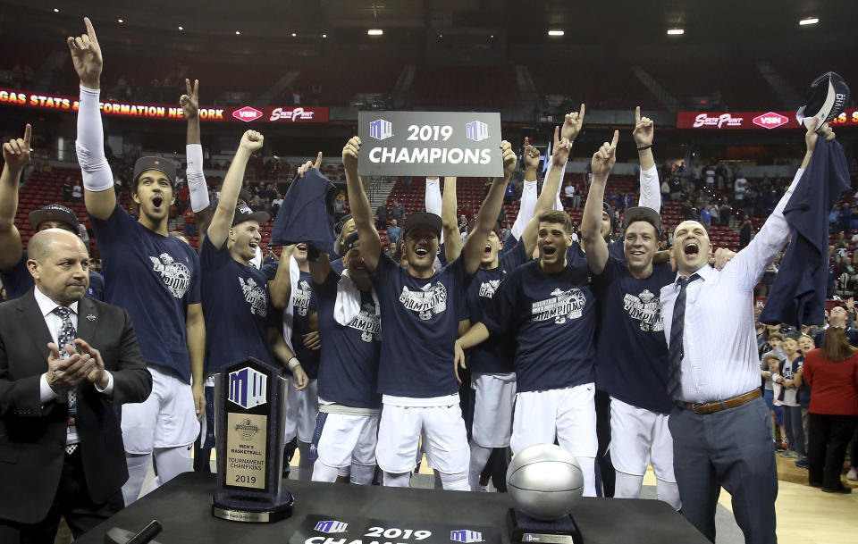 Utah State celebrates after defeating San Diego State following an NCAA college basketball game in the Mountain West Conference men's tournament championship Saturday, March 16, 2019, in Las Vegas. (AP Photo/Isaac Brekken)