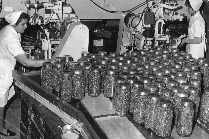 The production line, with jars of sweets bound for shelves in sweet shops in this undated image