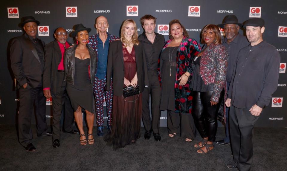 The Freedom Singers pose with Scott Fifer, Suki Waterhouse and Robert Pattinson