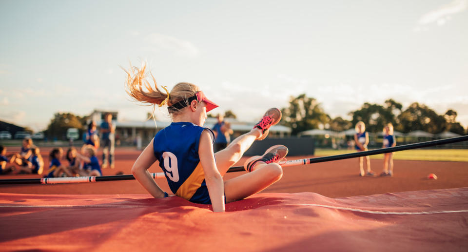 A girl doing little athletics.