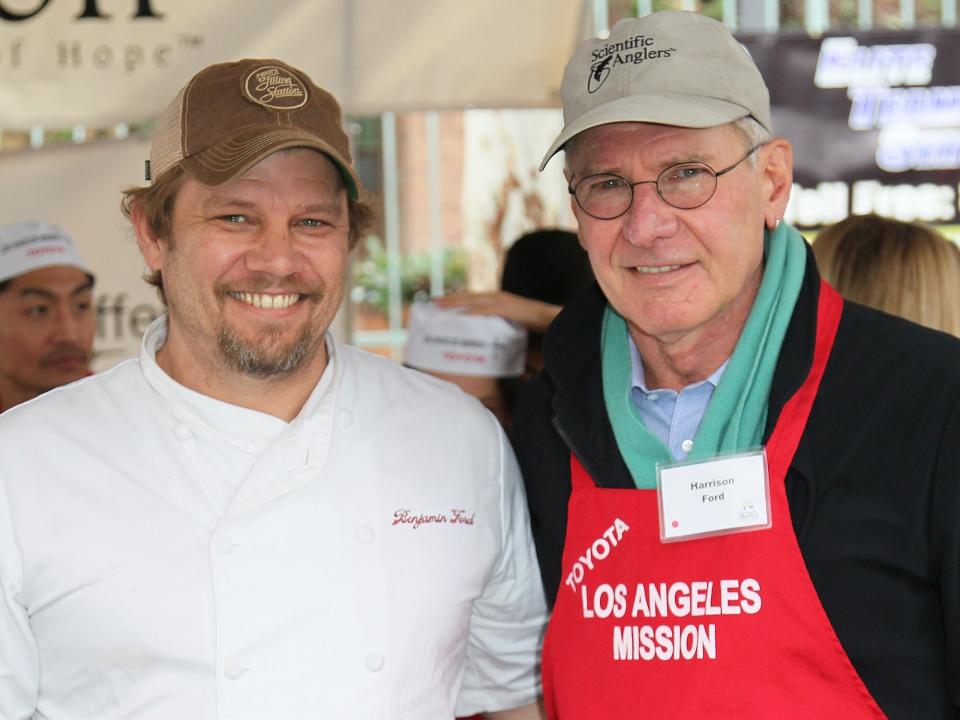 Chef Ben Ford (L) and father actor Harrison Ford attend the Los Angeles Mission's Christmas Eve for the homeless at the Los Angeles Mission on December 24, 2012 in Los Angeles, California