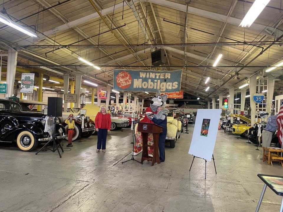 The Kansas City Chiefs mascot KC Wolf hugs Springfield Mayor Ken McClure during an announcement at the Route 66 Car Museum on Friday, July 21. McClure announced that the Chiefs Champions Tour will stop in Springfield during the Birthplace of Route 66 Festival Aug. 11.