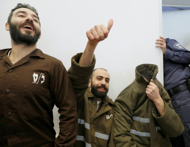 French national Romain Franck (R), a worker at the French consulate, and Palestinians Moufak al-Ajluni (L) and Mohamed Katout (C) appear in court in the Israeli city of Beersheba on March 19, 2018, to face charges of smuggling guns from Gaza