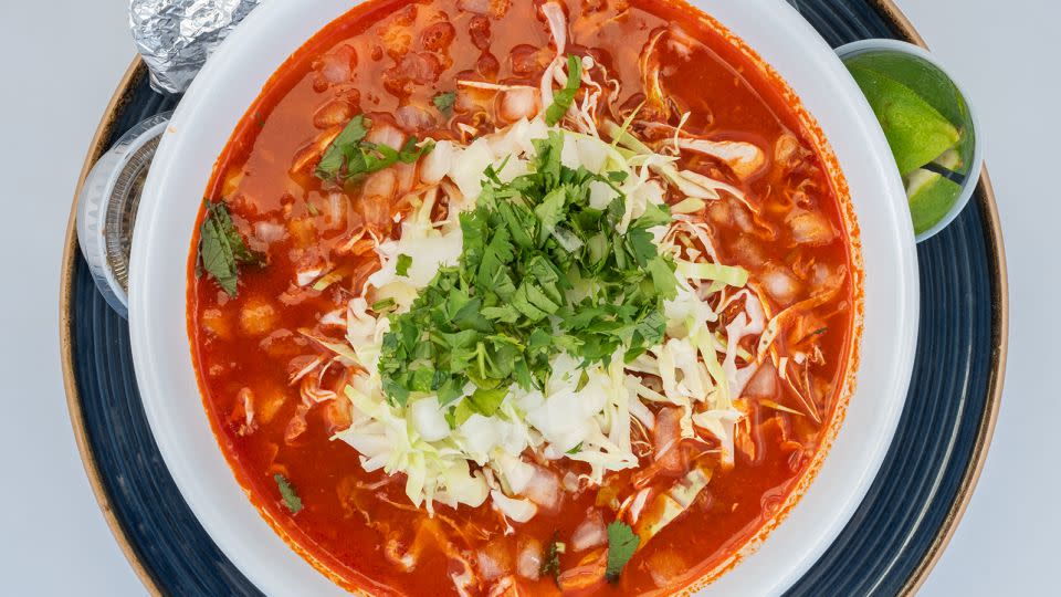 Posole is a traditional way to start a Mexican Christmas meal. - Shutterstock