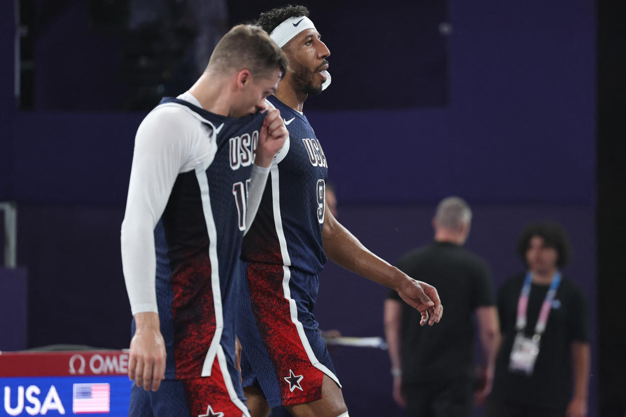 US' #15 Dylan Travis (L) and US' #09 Kareem Maddox react after the men's pool round 3x3 basketball game between Serbia and the USA during the Paris 2024 Olympic Games at La Concorde in Paris on July 30, 2024. (Photo by David GRAY / AFP) (Photo by DAVID GRAY/AFP via Getty Images)