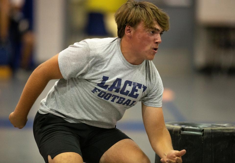 Lacey Township High School football team members go through drills during a practice session in the gym. Keith Sullivan.   Lanoka Harbor, NJTuesday, July 5, 2022