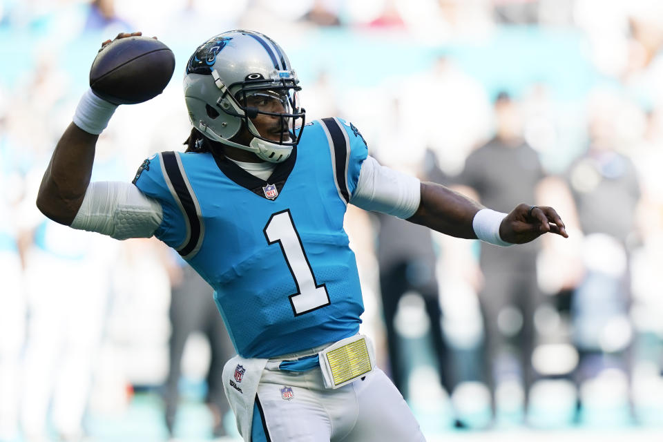 Carolina Panthers quarterback Cam Newton (1) aims a pass during the first half of an NFL football game against the Miami Dolphins, Sunday, Nov. 28, 2021, in Miami Gardens, Fla. (AP Photo/Wilfredo Lee)