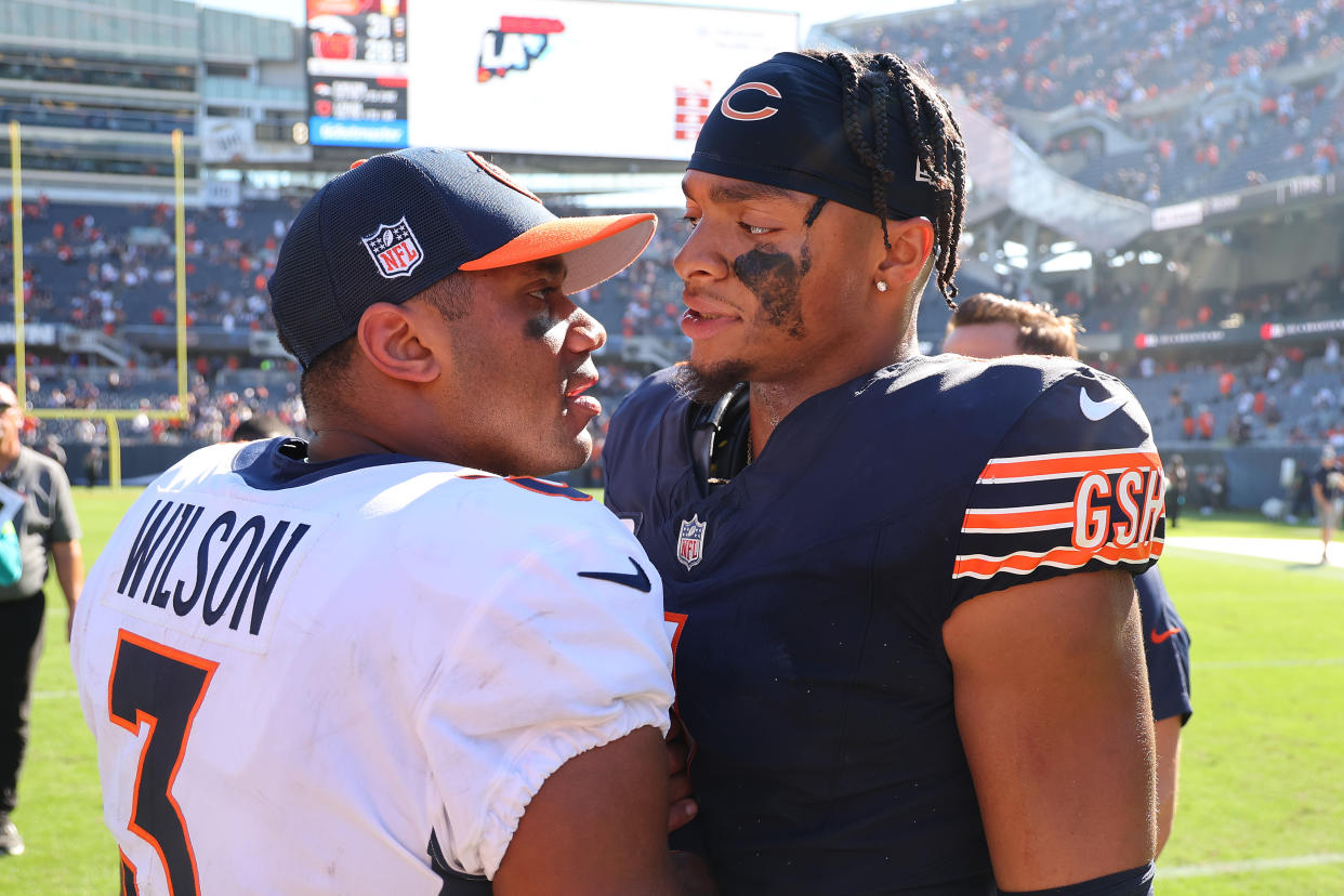 If the Steelers decide to pick up the fifth-year option on Justin Fields (right), it would put teammate Russell Wilson in an uncomfortable spot. (Photo by Michael Reaves/Getty Images)