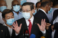 Former finance minister Lim Guan Eng speaks to media outside court house in Kuala Lumpur, Friday, Aug. 7, 2020. Lim has been charged with corruption over a $1.5 billion undersea tunnel project. Lim was part of a reformist government ousted in March, and his party slammed the criminal charge as political persecution by the new government. (AP Photo/Vincent Thian)