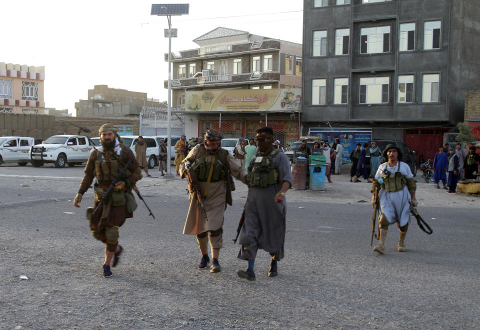 Private militia loyal to Ismail Khan, the former Mujahideen commander, patrols after security forces took back control of parts of Herat city following fighting between Taliban and Afghan security forces in Herat province, west of Kabul, Afghanistan, Friday, Aug. 6, 2021. (AP Photo/Hamed Sarfarazi)