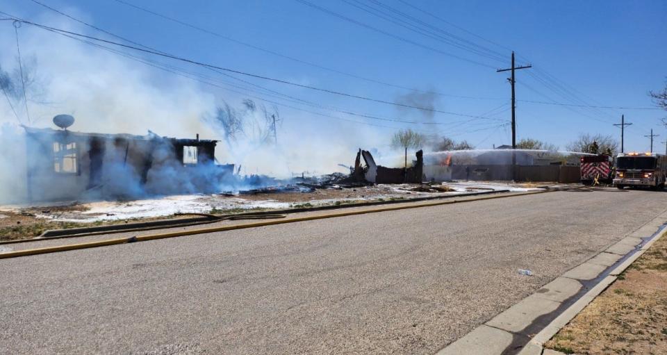 Amarillo firefighters battle a fire involving two structures near NW 3rd and N Jefferson near downtown Amarillo on Friday afternoon.