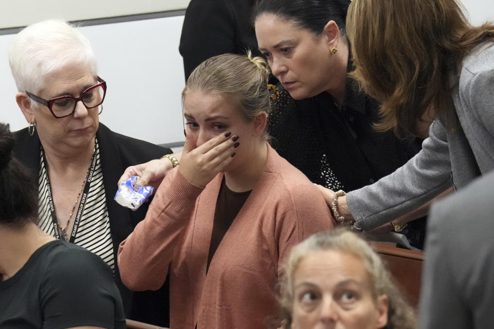 Meghan Petty is comforted as she takes a break from giving her victim impact statement during the sentencing hearing for Marjory Stoneman Douglas High School shooter Nikolas Cruz at the Broward County Courthouse in Fort Lauderdale, Fla., on Tuesday, Nov. 1, 2022. Petty's sister, Alaina, was killed in the 2018 shooting Cruz was sentenced to life in prison for murdering 17 people at Parkland's Marjory Stoneman Douglas High School more than four years ago. (Amy Beth Bennett/South Florida Sun Sentinel via AP, Pool)