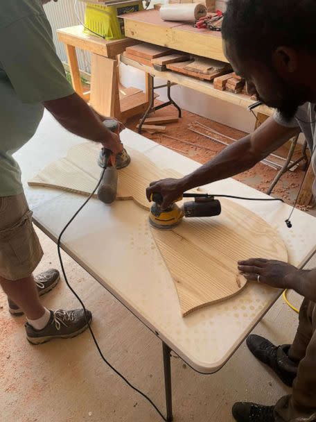 PHOTO: JassGraphix employees make one of the 21 butterfly memorial benches made in memory of the victims of the Robb Elementary School shooting. (Sean Peacock)