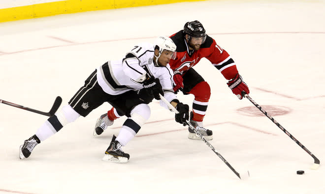 NEWARK, NJ - JUNE 02: Jordan Nolan #71 of the Los Angeles Kings and Stephen Gionta #11 of the New Jersey Devils go for a loose puck during Game Two of the 2012 NHL Stanley Cup Final at the Prudential Center on June 2, 2012 in Newark, New Jersey. (Photo by Jim McIsaac/Getty Images)