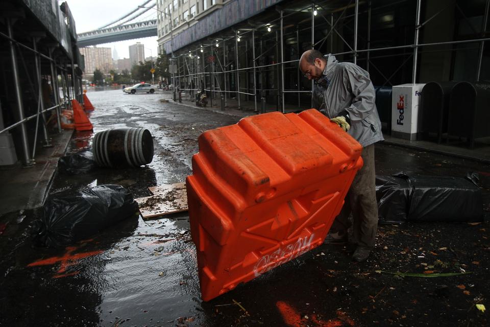 NEW YORK, NY - OCTOBER 30: Portable, upended flood dikes are viewed on a flooded street in the Dumbo section of Brooklyn after the city awakens to the affects of Hurricane Sandy on October 30, 2012 in New York, United States. At least 15 people were reported killed in the United States by Sandy as millions of people in the eastern United States have awoken to widespread power outages, flooded homes and downed trees. New York City was his especially hard with wide spread power outages and significant flooding in parts of the city. (Photo by Spencer Platt/Getty Images)