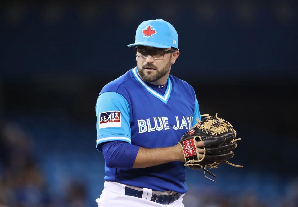 TORONTO, ON - AUGUST 25: TJ House #44 of the Toronto Blue Jays looks in before delivering a pitch in the ninth inning during MLB game action against the Minnesota Twins at Rogers Center on August 25, 2017 in Toronto, Canada.  (Photo by Tom Szczerbowski/Getty Images)