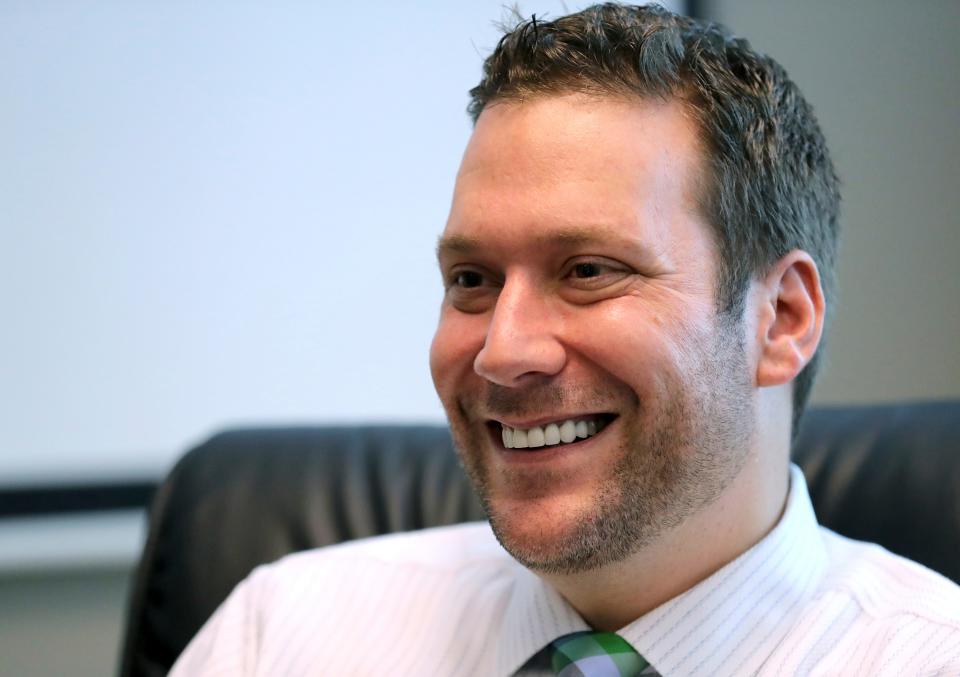 In this Sept. 30, 2019, file photo, Seminole County Tax Collector Joel Greenberg talks to the Orlando Sentinel during an interview at his office in Lake Mary, Fla. Greenberg has been charged with trafficking a minor, stalking a political opponent, producing fake IDs, identity theft, embezzlement and bribery. But it's his friendship with U.S. Rep. Matt Gaetz that is attracting the most attention now as federal investigators have launched a sex trafficking probe into the Republican congressman from the Florida Panhandle. (Joe Burbank/Orlando Sentinel via AP, File)