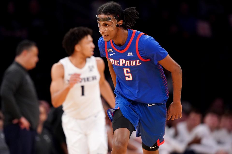 DePaul Blue Demons guard Philmon Gebrewhit (5) reacts after making a 3-point basket in the first half of an NCAA college basketball game against the Xavier Musketeers during the second round of the Big East conference tournament, Thursday, March 9, 2023, at Madison Square Garden in New York. 