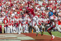 Alabama wide receiver DeVonta Smith (6) leaps into the air for his fourth touchdown reception well ahead of coverage from Mississippi defensive back Keidron Smith (20) during the first half of an NCAA college football game, Saturday, Sept. 28, 2019, in Tuscaloosa, Ala. (AP Photo/Vasha Hunt)