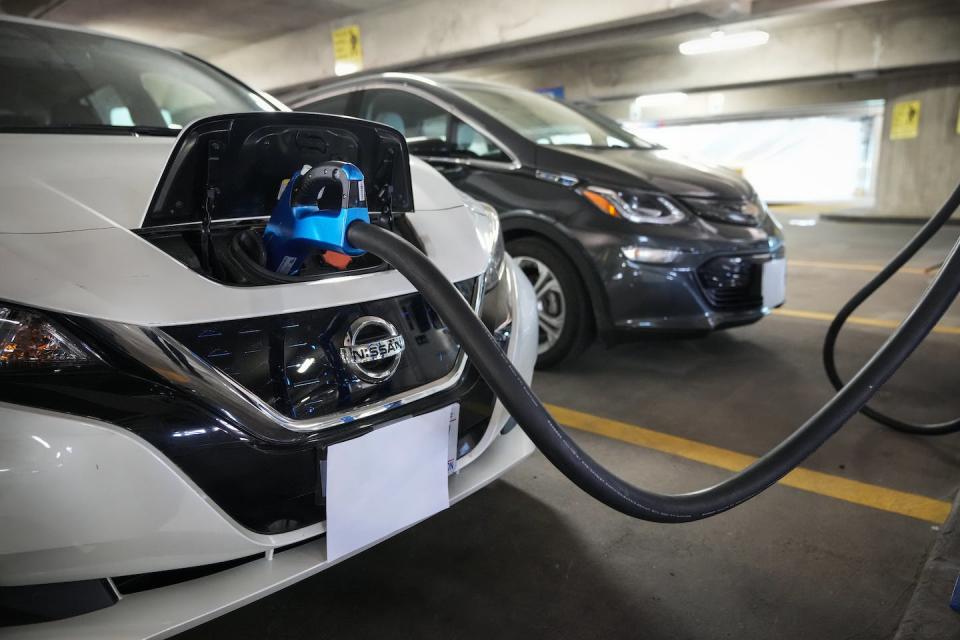 EVs are getting more affordable, but creating enough charging infrastructure is still a challenge in many areas. <a href="https://www.gettyimages.com/detail/news-photo/electric-vehicles-are-displayed-before-a-news-conference-news-photo/1232464481" rel="nofollow noopener" target="_blank" data-ylk="slk:Drew Angerer/Getty Images;elm:context_link;itc:0;sec:content-canvas" class="link ">Drew Angerer/Getty Images</a>