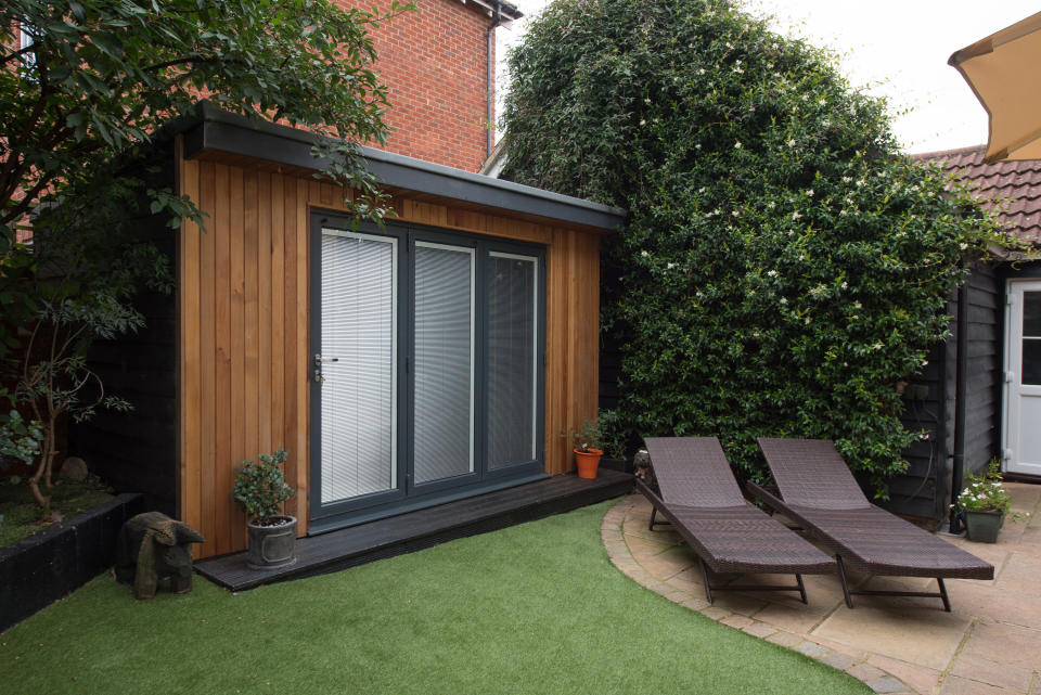 Wood-paneled "shed" with livable space inside