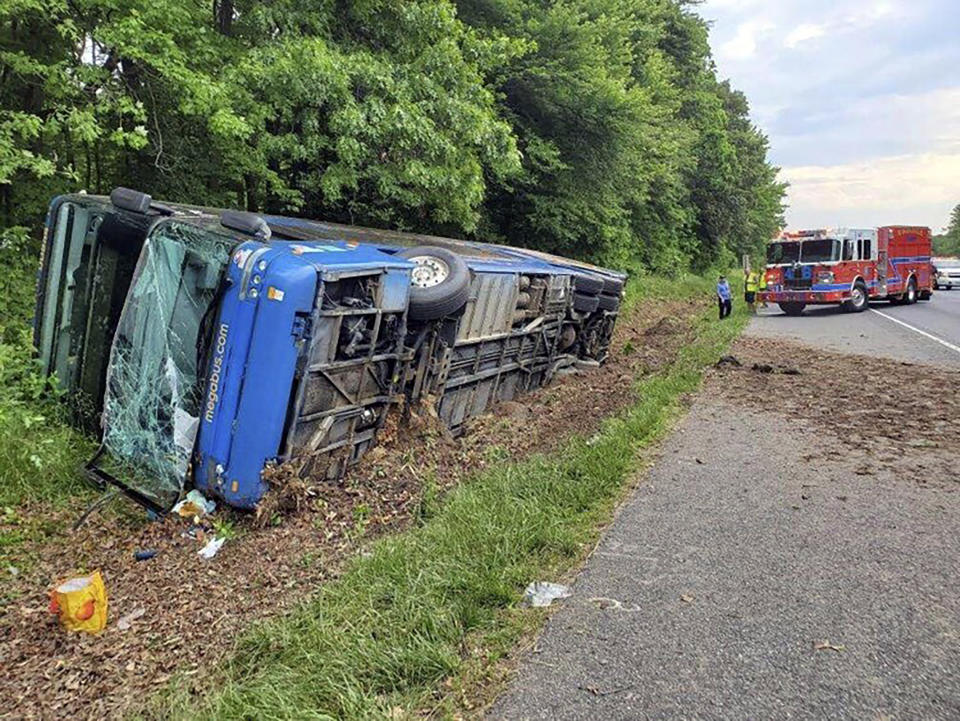 This image provided by the Baltimore County Fire Department shows the scene of a Megabus crash on I-95 south near Kingsville, Md., Sunday, May 22, 2022. (Baltimore County Fire Department via AP)