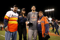 <p>George Springer #4 of the Houston Astros holds the 2017 Willie Mays World Series Most Valuable Player (MVP) Award as he poses with family members after defeating the Los Angeles Dodgers 5-1 in game seven to win the 2017 World Series at Dodger Stadium on November 1, 2017 in Los Angeles, California. (Photo by Christian Petersen/Getty Images) </p>