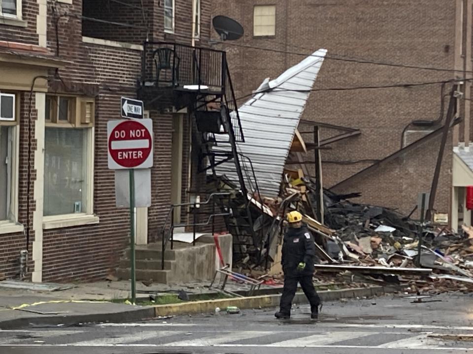 Emergency personnel work at the site of a deadly explosion at a chocolate factory in West Reading, Pa., Saturday, March 25, 2023. (AP Photo/Michael Rubinkam)