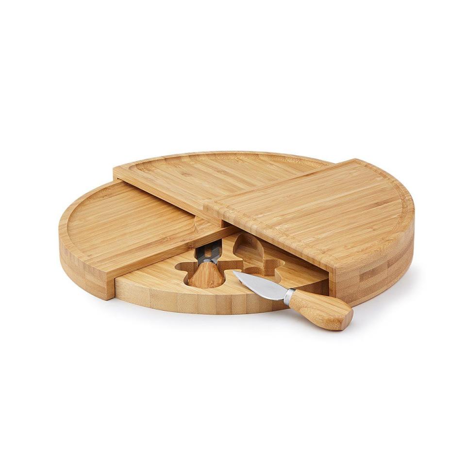 <p>uncommongoods.com</p><p><strong>$45.00</strong></p><p>Some couples love entertaining and playing host for the night—and there's nothing more necessary for that than the right boards on which to serve food with. This swivel cheese board looks cool on the counter but easily stows away. </p>
