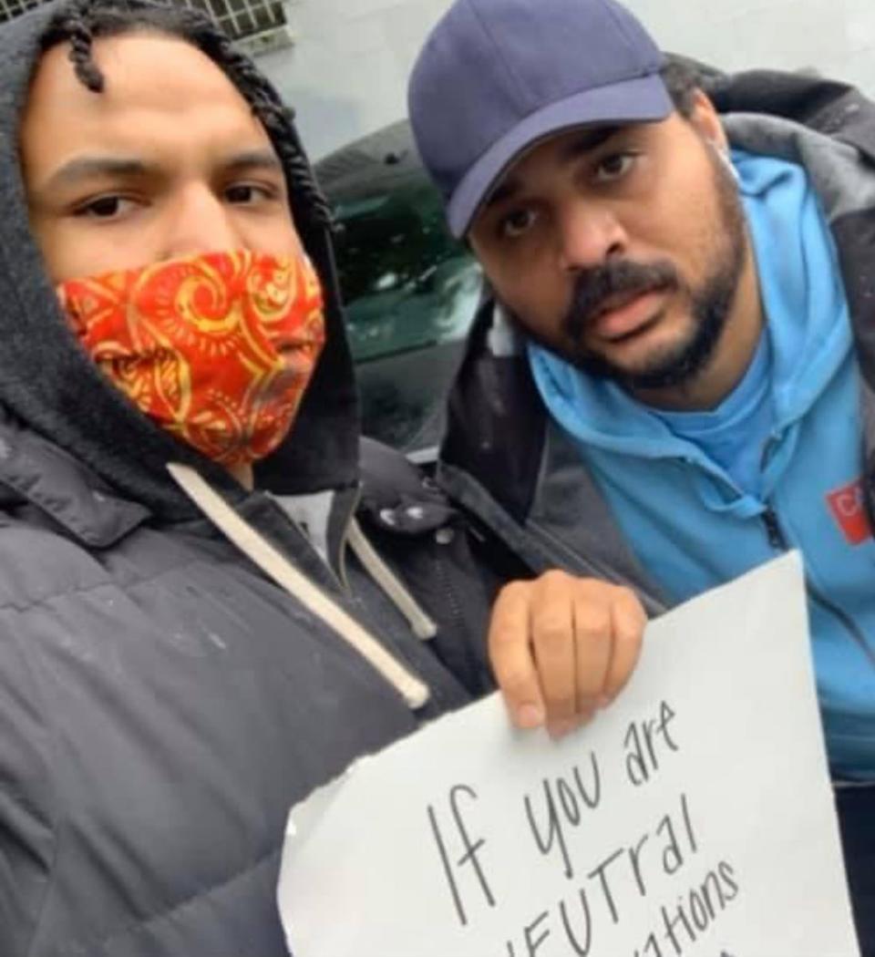 Elijah Lewis with his brother, Mario Dunham. The Seattle activist promoted nonviolence and worked to build the Black community. He was shot and killed in April 2023.